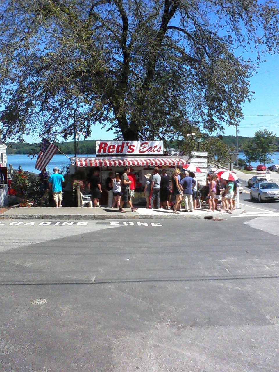 A view of people coming to the stall of the Red's Eats early in the morning.